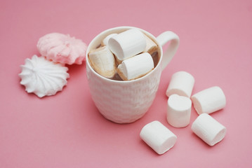 Cup of Hot Chocolate with Marshmallows on Pink Background. Top View, pink and White Meringue