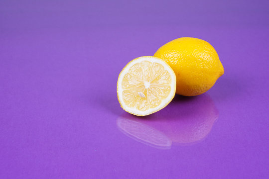 Lemon on purple background
