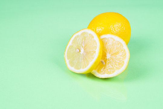 Lemon on green background