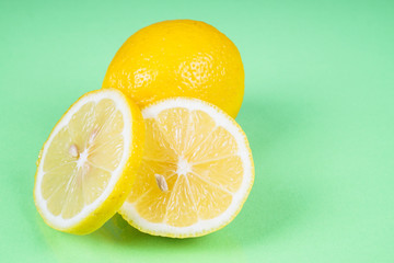 Lemon on green background