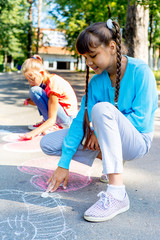 Kids drawing with chalk