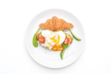 egg benedict with avocado, tomatoes and salad - healthy or vegan food style