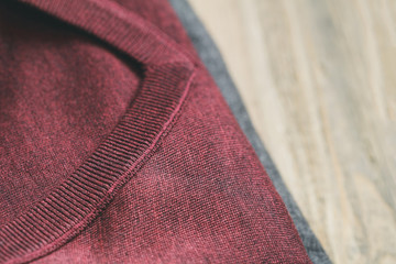 Woolen burgundy men's pullover. View from above.