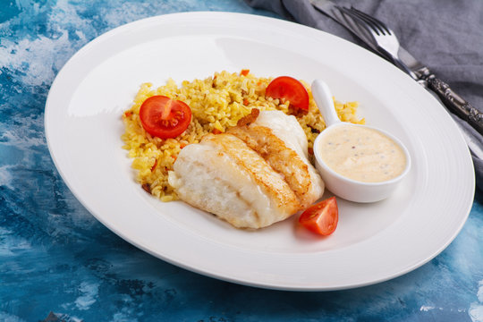 Fried pike perch fillet and bulgur. Fried fish dinner. Healthy eating