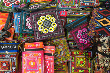 Fototapeta na wymiar embroidered wallets and purses, Vietnam souvenirs