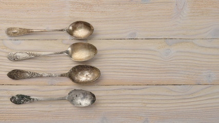 Old cutlery. On a wooden background. Top view. Free space for text.