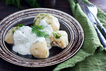 Traditional Lithuanian dish meal cuisine - stuffed meat potato dumpling (Cepelinai,didzkukuliai),most popular Lithuanian national dish, curd, similar to polish