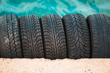 Obraz premium Used car tyres stack