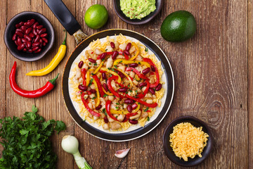 Quesadilla with chicken, served with guacamole or salsa sauce.