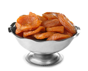 Dried apricots in bowl on white background