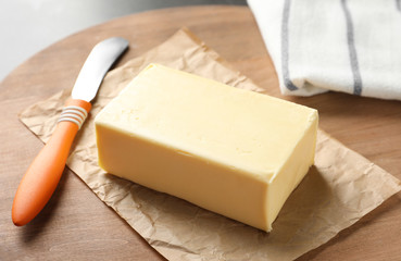 Fresh butter on wooden board, closeup