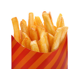 Paper bag with yummy french fries on white background, closeup