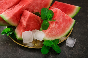 Plate with tasty sliced watermelon on table