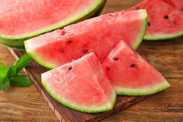Tasty sliced watermelon on table