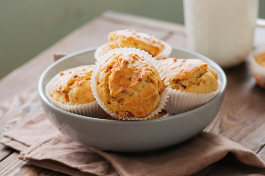 Homemade muffins with bacon and cheesein a bowl. Healthy snack or breakfast meal.