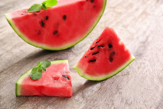 Tasty sliced watermelon on wooden background