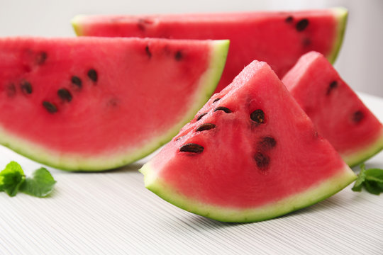 Tasty sliced watermelon on light background