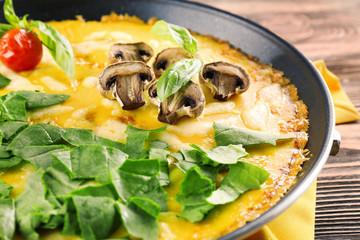 Tasty frittata with spinach, closeup