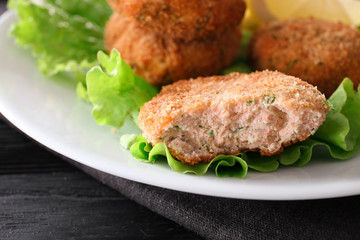 Plate with tasty salmon patties, closeup