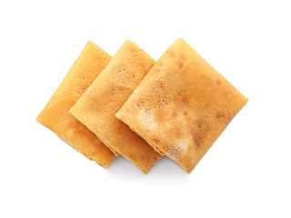 Delicious thin pancakes on white background
