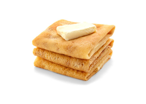 Delicious thin pancakes on white background