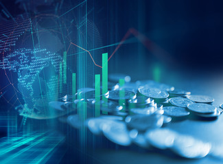 pile of coins on technology financial graph background.