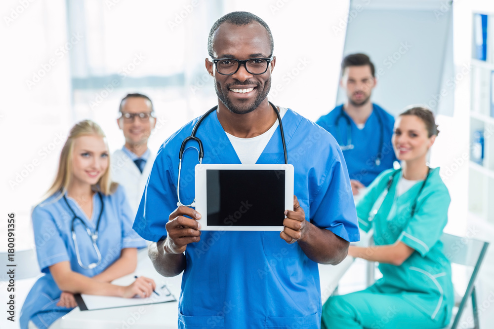 Wall mural doctor holding tablet