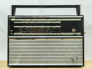 Vintage radio on wall background