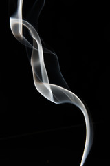 white smoke pattern on black background
