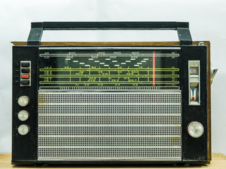 Vintage radio on wall background
