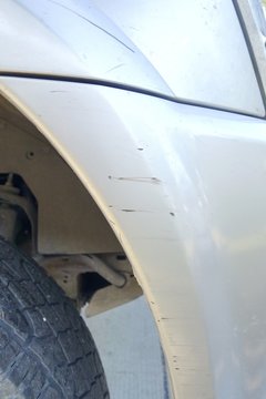 Scratched front bumper car