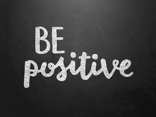 Obraz premium BE POSITIVE hand lettering on blackboard