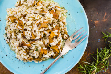 Risotto with chanterelle mushrooms and herbs. Italian food. 