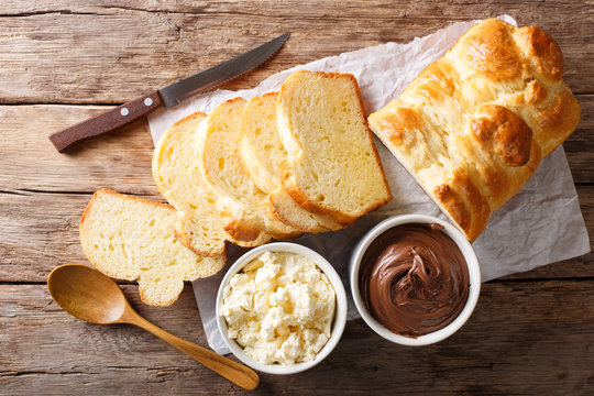 Freshly brioche bread and cream cheese, chocolate cream. horizontal top view