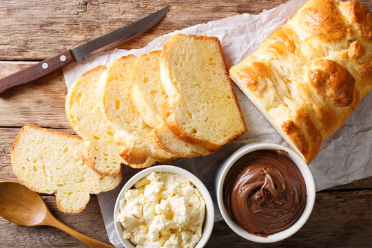 French brioche bread and cream mascarpone cheese, chocolate cream close-up. Horizontal top view