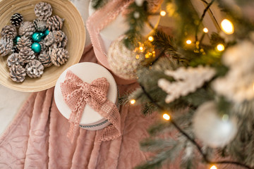 Xmas Christmas gifts under the Christmas tree. Christmas tree with balls, garlands, in gold colors. The concept of Christmas and happy new year. The spirit of Christmas