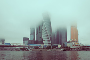 Fototapeta na wymiar Skyscrapers of Moscow city in fog