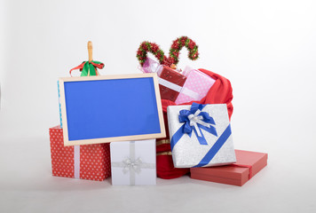 Many gift boxes and blue billboard on white background