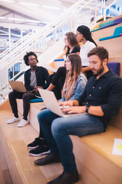 Young adult team in a startup office working together