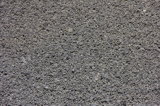 Background porous stone structure of volcanic origin  gray color.
