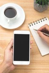 Hand use phone blank screen top view