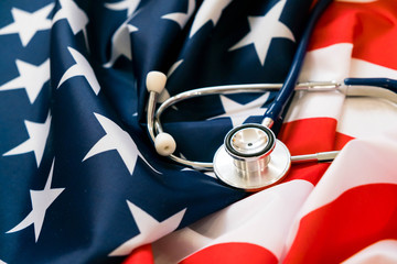Close-up Photo Of Stethoscope On American Flag. medicine USA