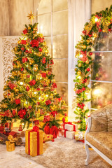 Christmas shining tree with decorations, tinsel, star, balls. Interior in vintage style. New year holidays.
