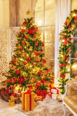Christmas shining tree with decorations, tinsel, star, balls. Interior in vintage style. New year holidays.