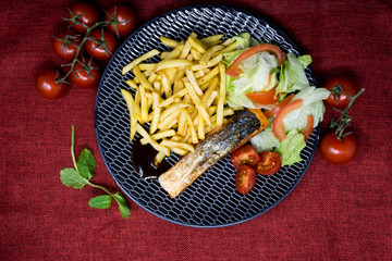 Grilled Salmon with fresh lettuce and french fries