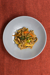 wok fried chicken stir fry with sweet peppers and chinese vegetables