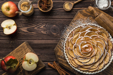 sweet autumn apple tart on wooden background