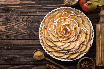 sweet autumn apple tart on wooden background