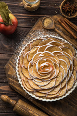 sweet autumn apple tart on wooden background