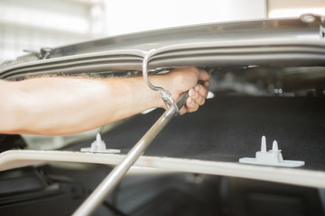 Repairing dents in a car